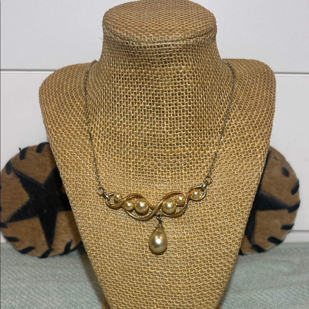 Vintage gold-tone necklace with faux pearls and drop pearl pendant.